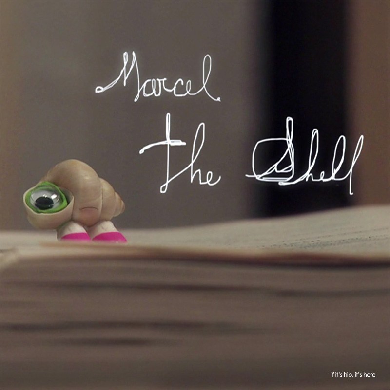 Marcel the Shell on a book 