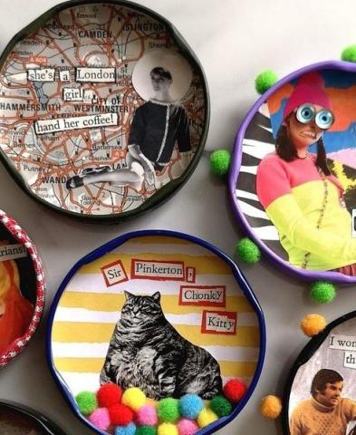 Close up image of the inside of jar lids decorated with collages, words, and pompoms.
