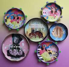 various upcycled jar lids with photo collages on them