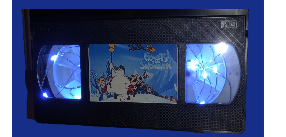 vhs tape with fairy lights and Frosty the Snowman movie sticker